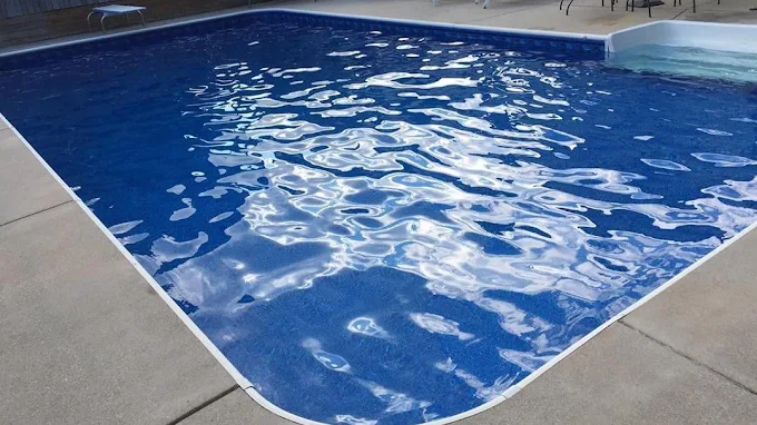 Backyard pool with clear blue water
